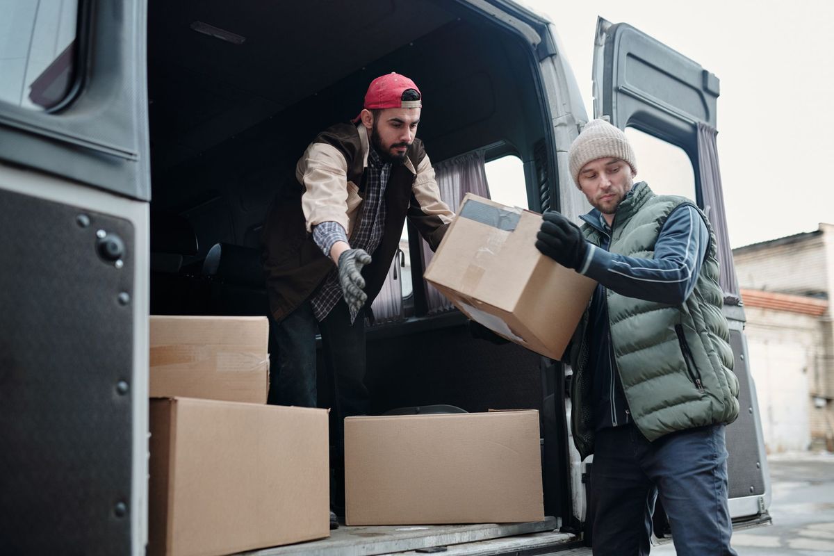 Teamwork Moving crew loading boxes for a Phoenix family move