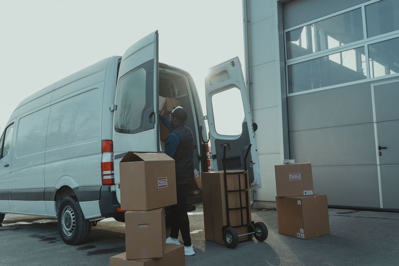 Happy Phoenix family standing with moving boxes after a successful home move