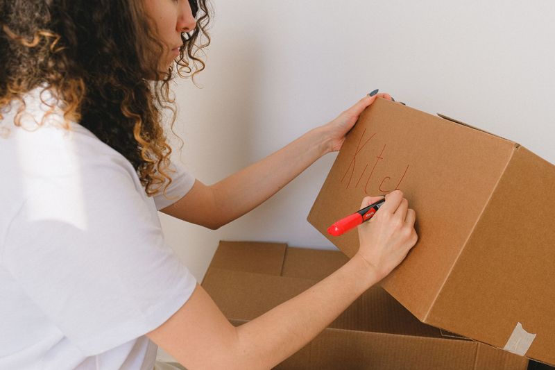 Family welcoming movers into a new home after a long-distance move