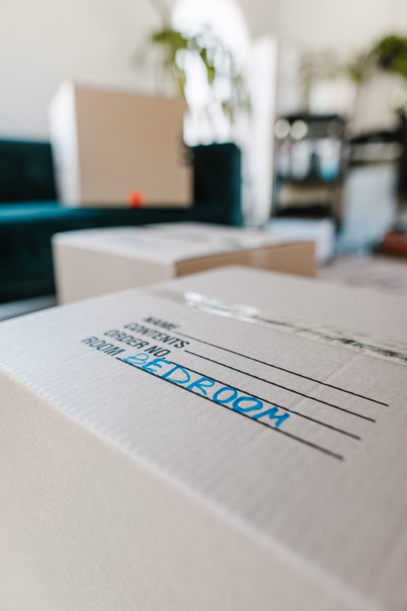 Clearly labeled moving boxes organized by room